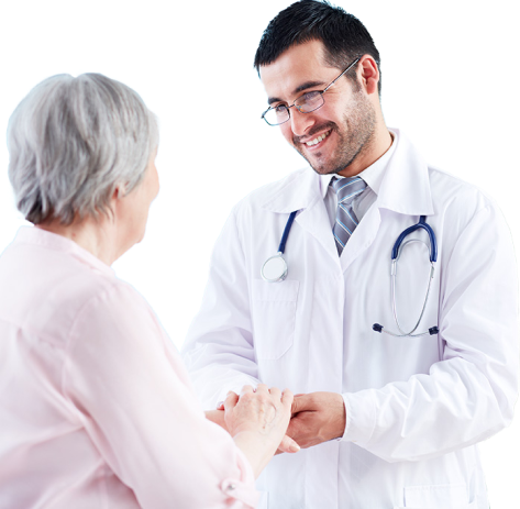 A male doctor wearing a lab coat clasps hands with an elderly patient