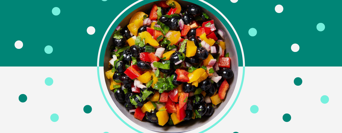 Top-down view of blueberry salsa: blueberries, red and yellow bell pepper, and other ingredients