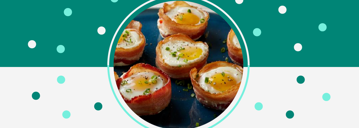 Bacon and egg cups: cooked egg white and yolk wrapped in bacon and topped with chives