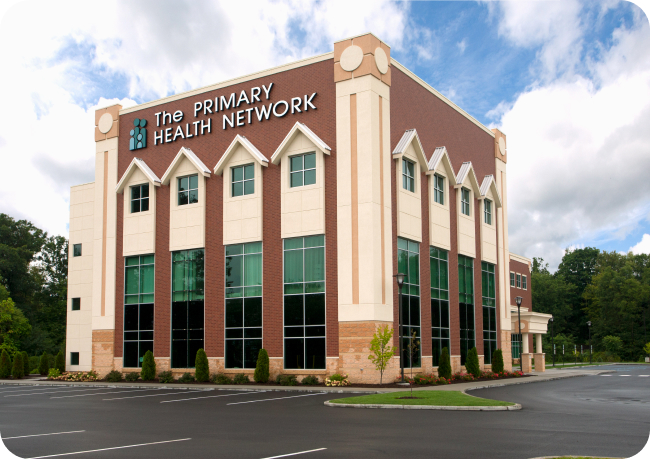 Wide streetview of Punxsutawney Community Health Center. Building says The Primary Health Network