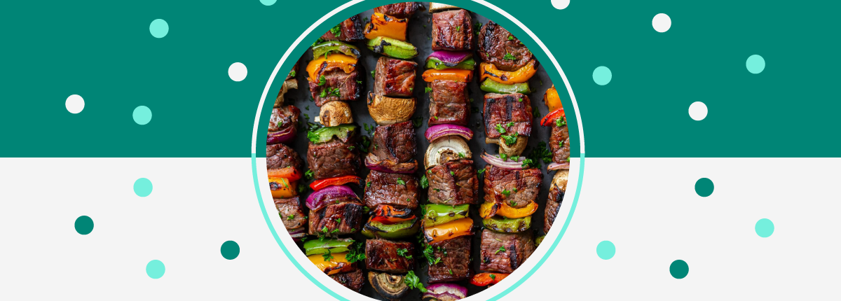 Grilled steak shish kebabs featuring bell peppers, mushrooms, and purple onions