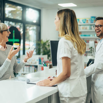 Women discussing her prescription with pharmacist