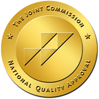 Gold The Joint Commission National Quality Approval seal on white background