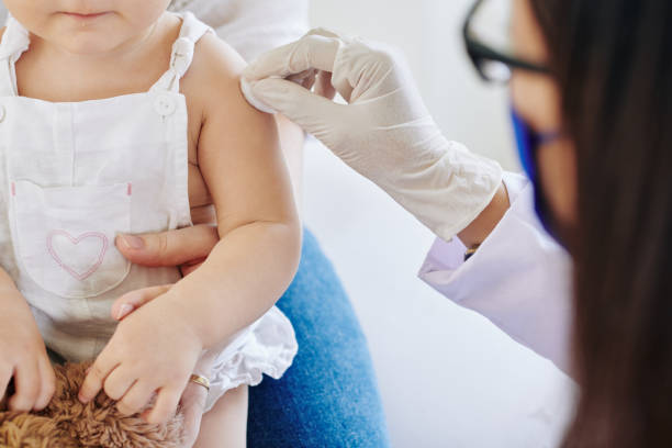 A child receiving a vaccine during National Infant Immunization Week