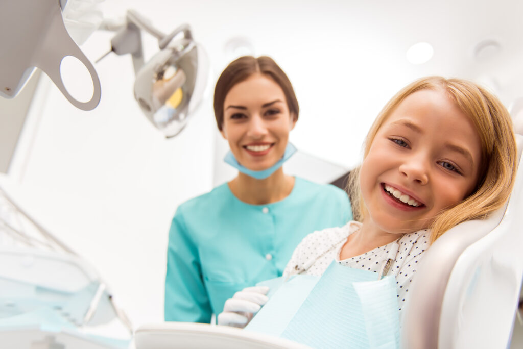 Child and Hygenist Smiling