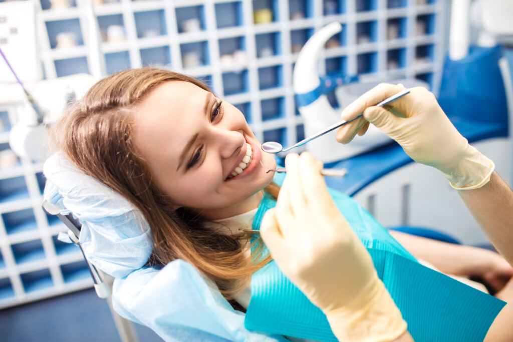 Lady Smiling in Dentist Chair
