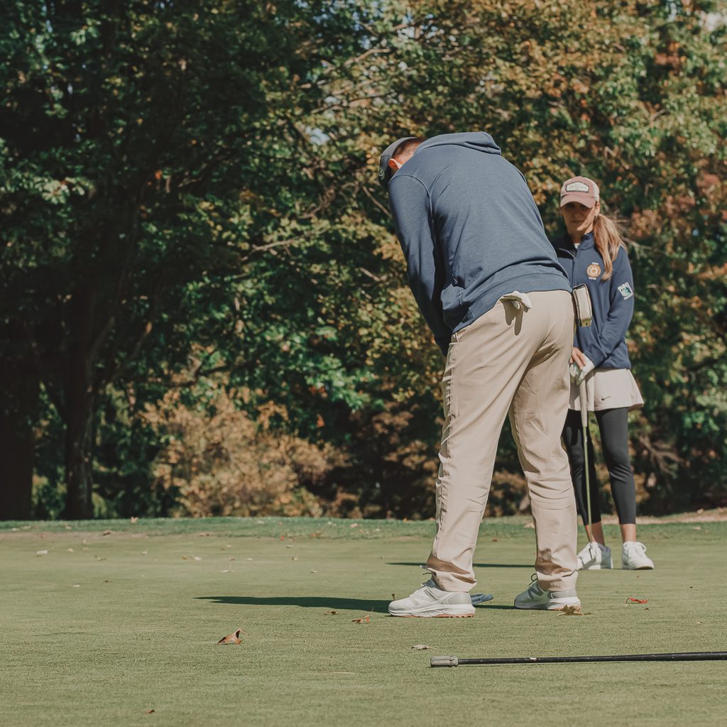 A male golfer putting