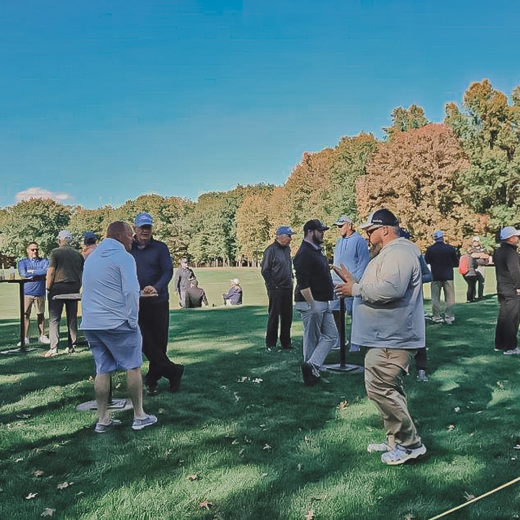 A group of golfers celebrating the end of the outing