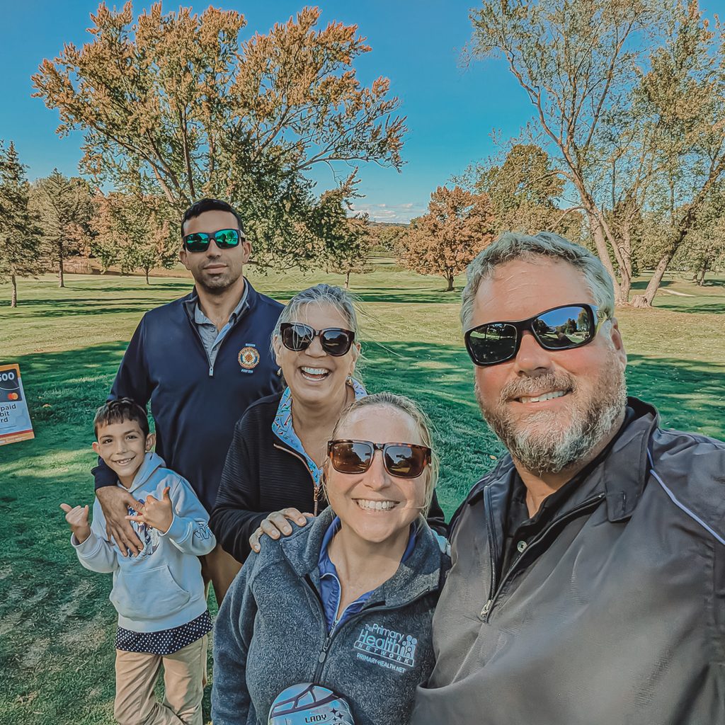 A family photo of golfers at the outing