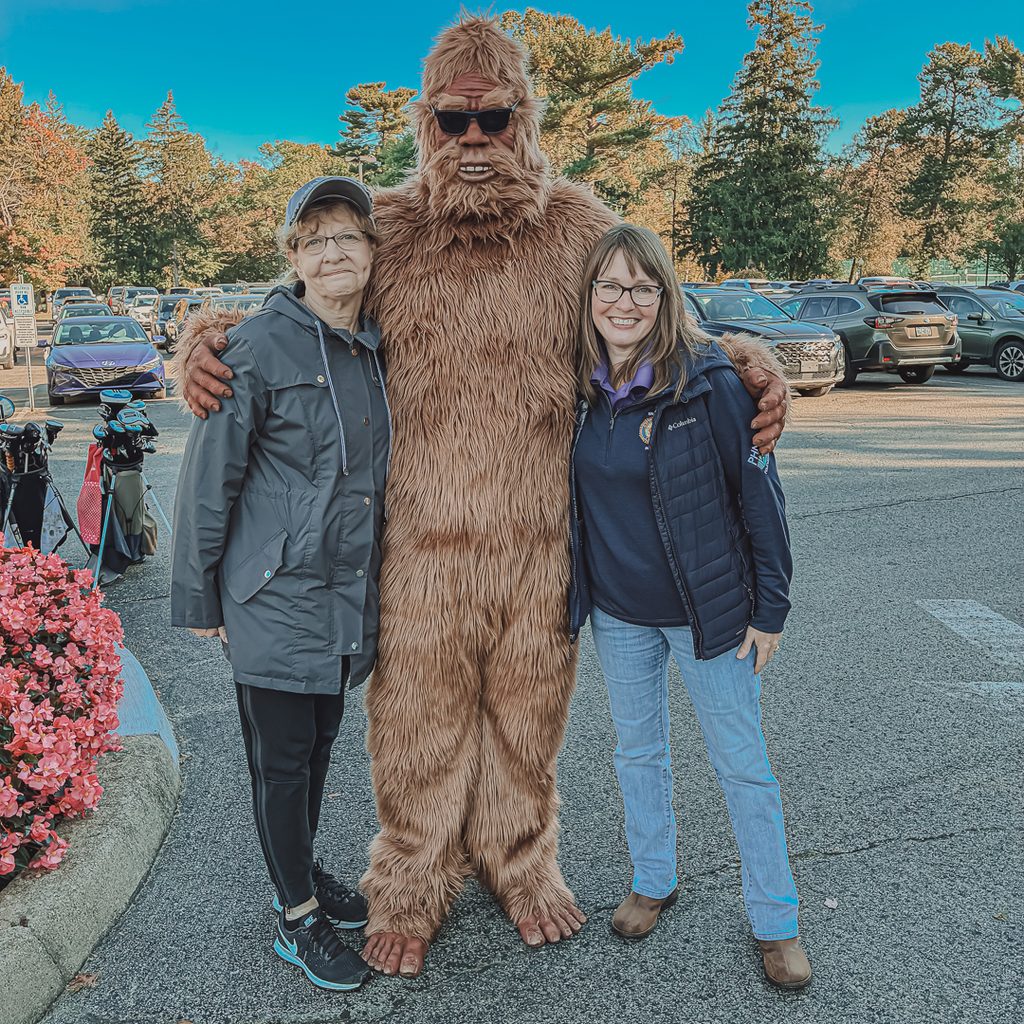 Two members of the PHN Charitable Foundation team posing with the Sharon Sasquatch