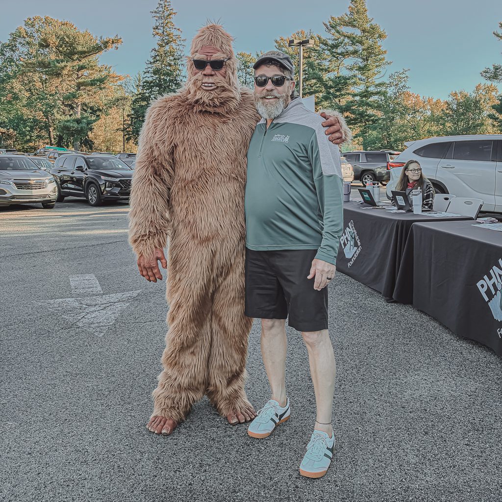 PHN CEO, Dr. George Garrow, posing with the Sharon Sasquatch