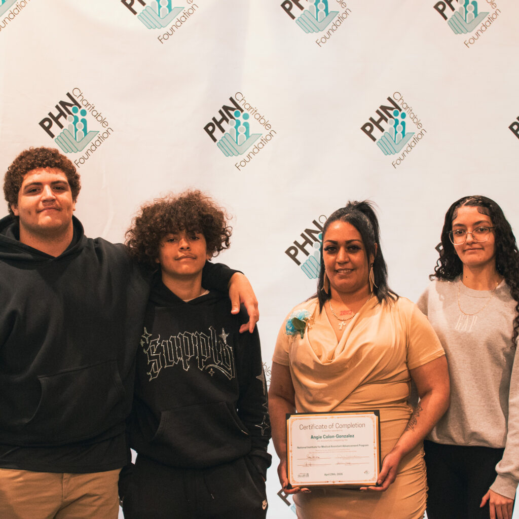 Group photo featuring Angie Colon-Gonzalez holding her certificate for graduating from the 2025-2026 NIMAA cohort.