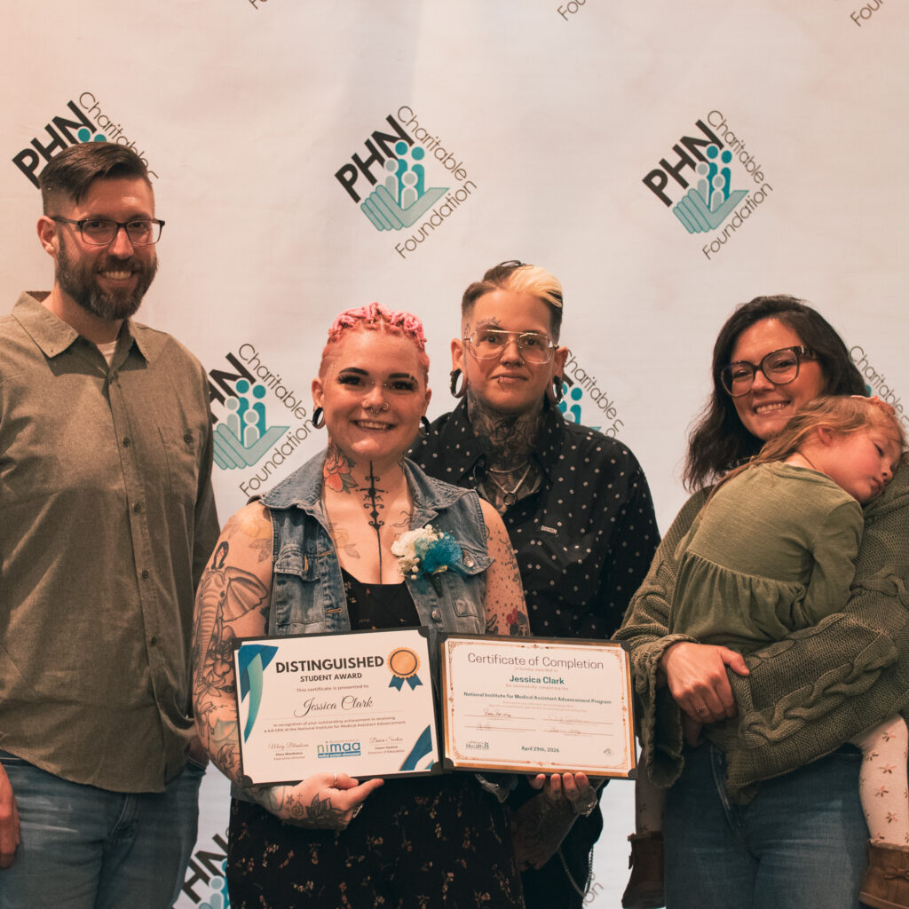 Group photo featuring Jessica Clark holding her certificate for graduating from the 2025-2026 NIMAA cohort.